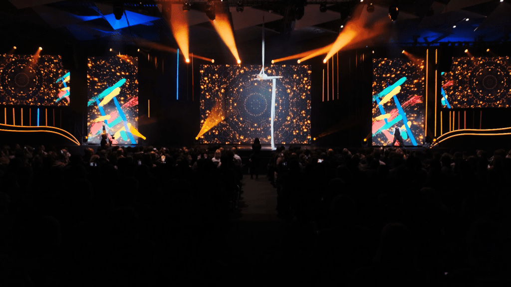 An aerial dancer whils in front of 3D content for the Xero conference in Johannesburg